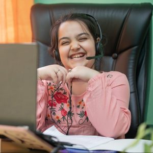 Young Student with donated laptop for schoolwork