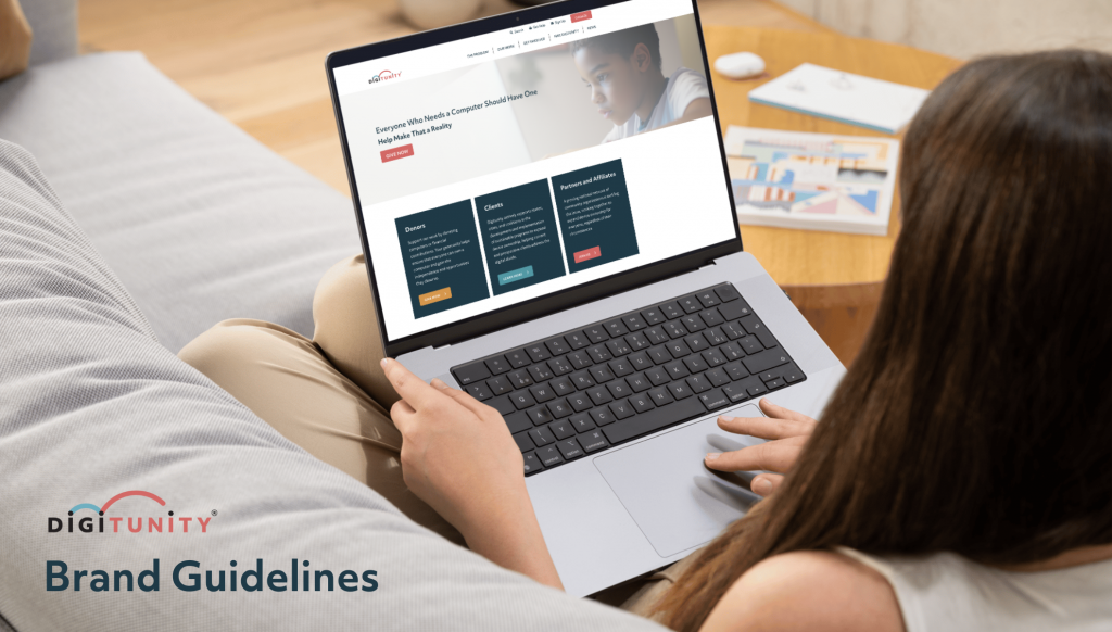 A person seated on a couch uses a laptop displaying a website with the heading "Digitunity Brand Guidelines." A magazine is on the table beside them.