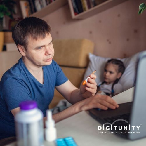 father at laptop using telehealth